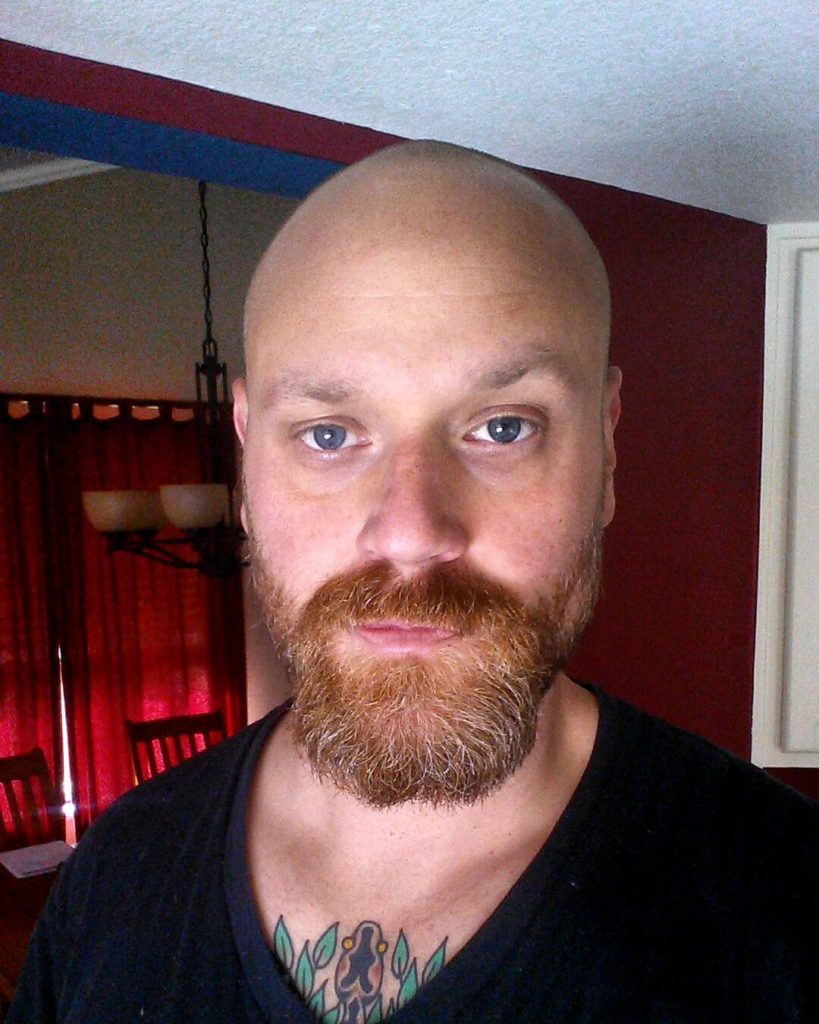 Ginger beard with a bald head