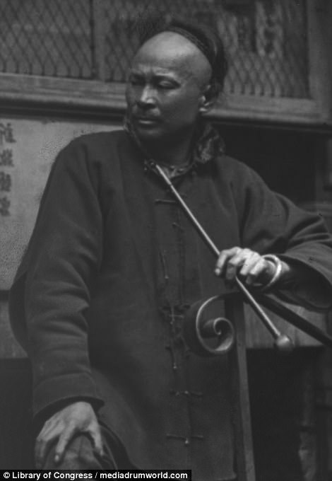 Chinatown in San Francisco was established in 1848, but was destroyed by an earthquake and a series of fires in 1906, killing an estimated 3,000 people. Pictured is a shoemaker