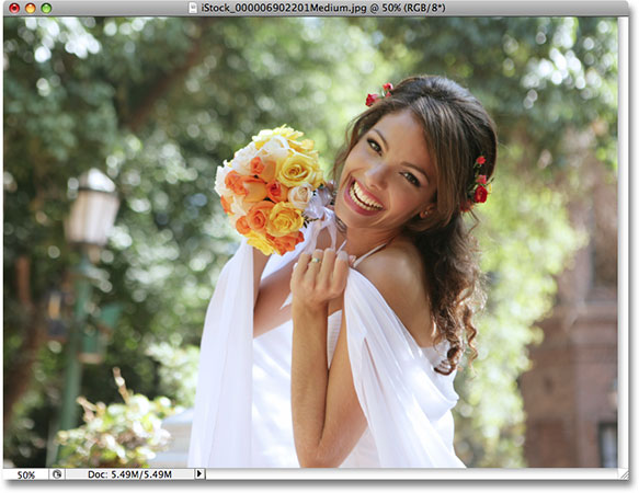 A photo of a bride smiling. Photo licensed from iStockphoto by Photoshop Essentials.com
