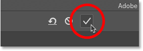 Clicking the checkmark to crop the image in Photoshop