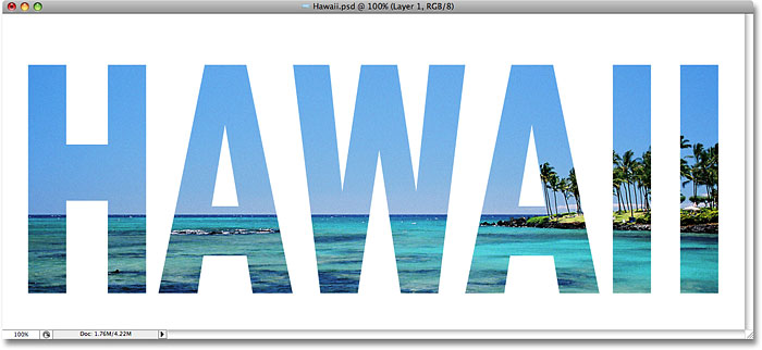 The photo now appears inside the text in Photoshop. Image © 2008 Photoshop Essentials.com.